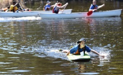 Student on paddle board at Adventure Race