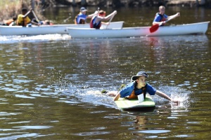 Student on paddle board at Adventure Race