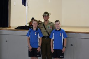 Major Kerryn Munday and her sons at the ANZAC Memorial Service