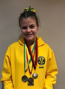 Sarah with netball award medals